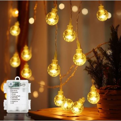 Aigostar - Cordão LED para exterior 100xLED/3xAA/8 funções 10,3 m IP44 branco quente