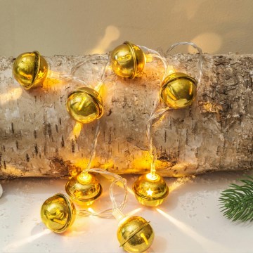 Cadeia de luzes de Natal LED 10xLED/2xAA/branco quente 1,8m com guizos