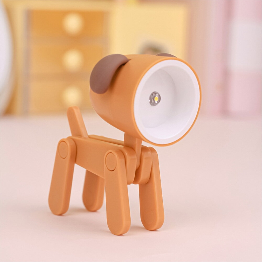 Luminária de mesa LED LED/0,06W/3xLR41 em forma de cão laranja