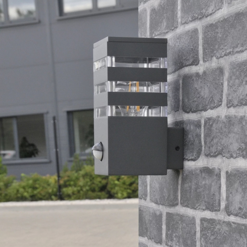 Luminária de parede exterior com sensor TEKSAS 1xE27/12W/230V IP44 antracite