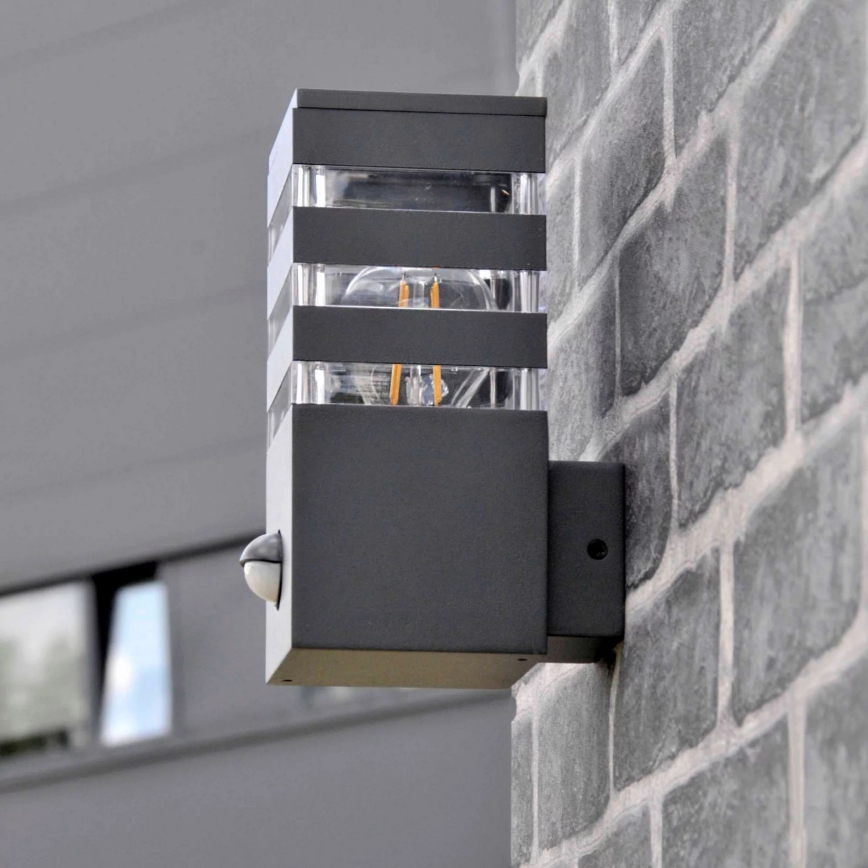 Luminária de parede exterior com sensor TEKSAS 1xE27/12W/230V IP44 antracite