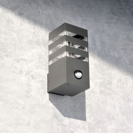 Luminária de parede exterior com sensor TEKSAS 1xE27/12W/230V IP44 antracite