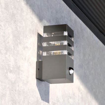 Luminária de parede exterior com sensor TEKSAS 1xE27/12W/230V IP44 antracite