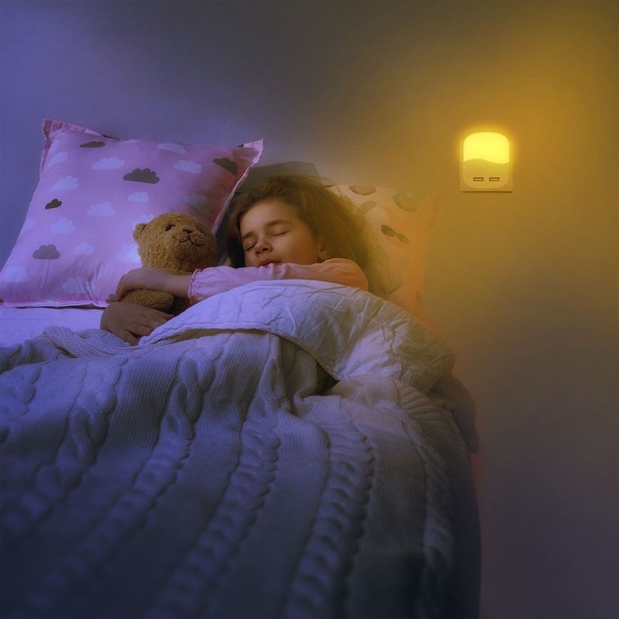 Luz LED noturna com sensor de anoitecer 2xUSB LED/0,45W/230V 3000K