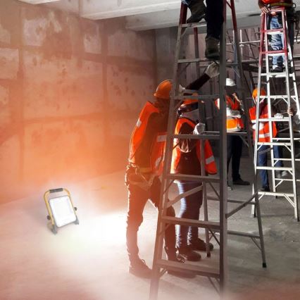 Refletor LED recarregável com tripé LED/50W/3,2V 4500K 5000 mAh IP65 laranja