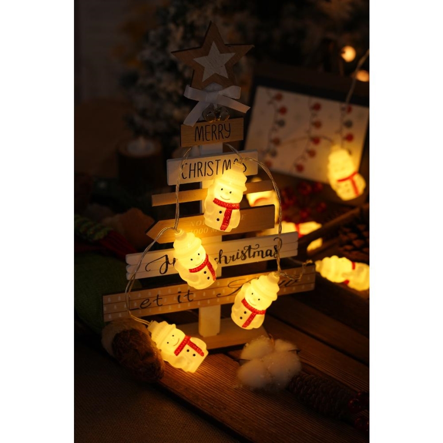 Cordão de luzes LED 20 LEDs / 3x pilhas AA / branco quente / 3,3 m - bonecos de neve