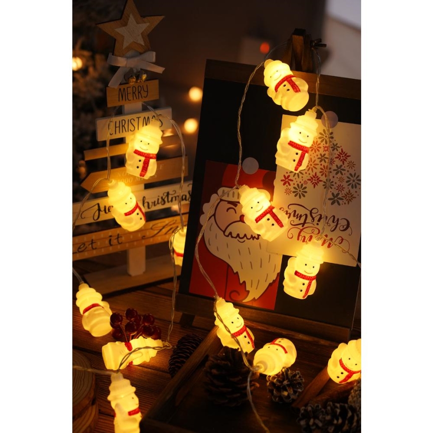 Cordão de luzes LED 20 LEDs / 3x pilhas AA / branco quente / 3,3 m - bonecos de neve