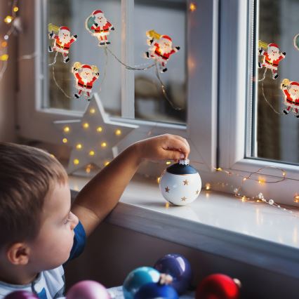 Cordão de LED com ventosas 6xLED/2xAA 1,2m branco quente Papai Noel