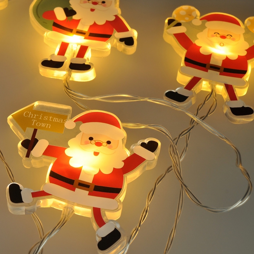 Cordão de LED com ventosas 6xLED/2xAA 1,2m branco quente Papai Noel