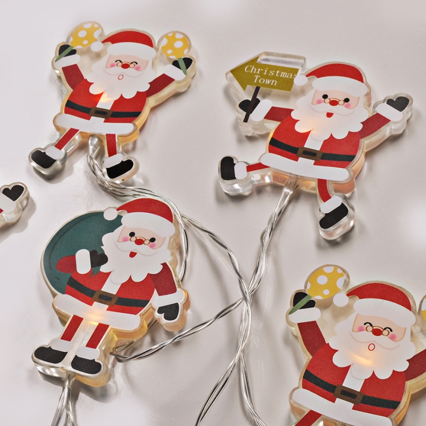 Cordão de LED com ventosas 6xLED/2xAA 1,2m branco quente Papai Noel