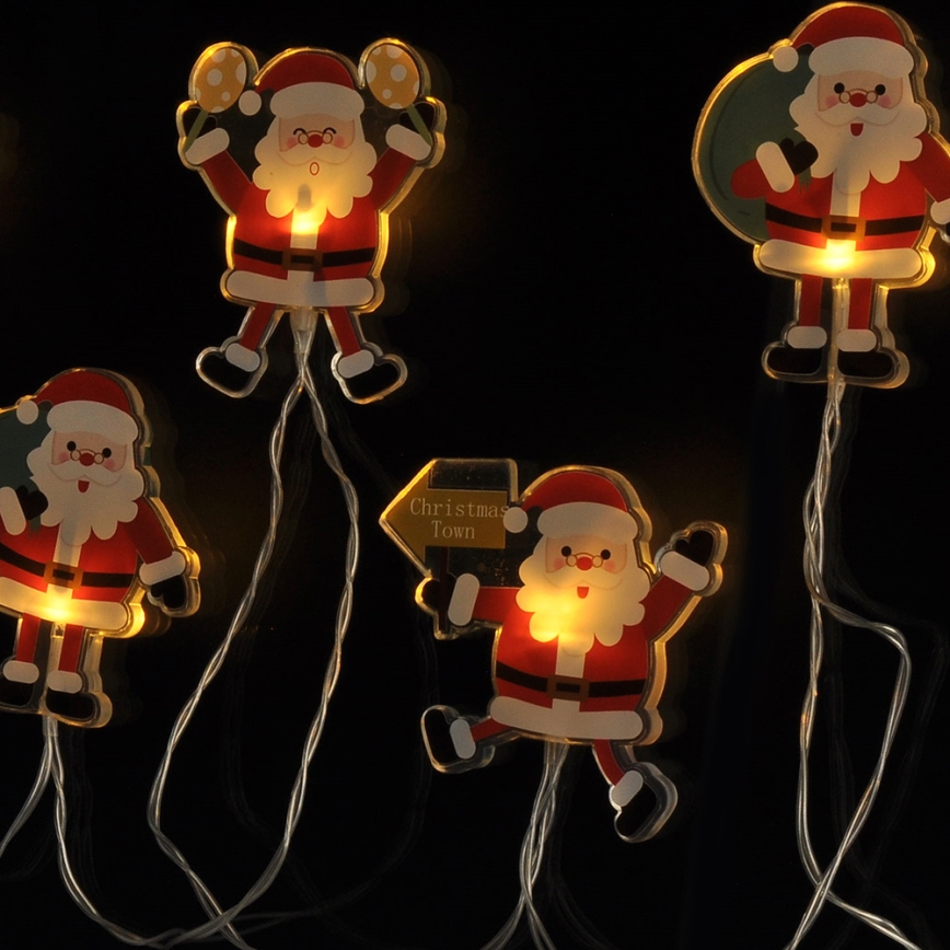 Cordão de LED com ventosas 6xLED/2xAA 1,2m branco quente Papai Noel