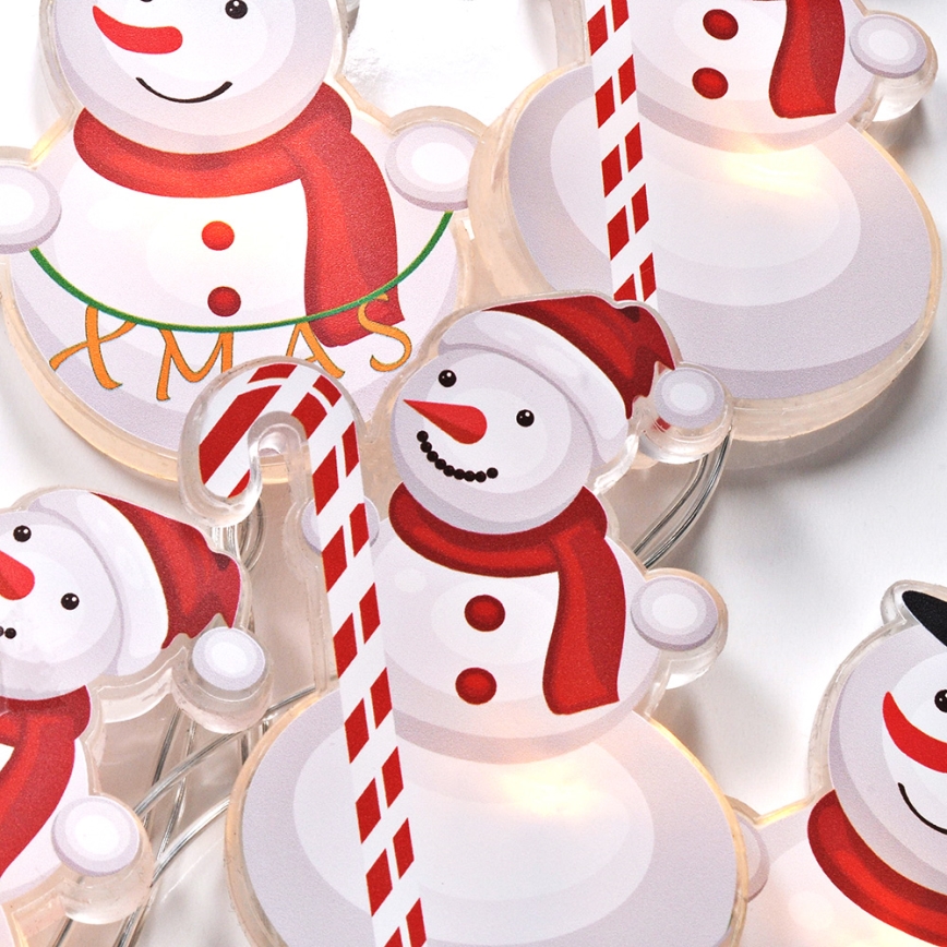Guirlanda LED com ventosas 6xLED/2xAA 1,2m branco quente boneco de neve