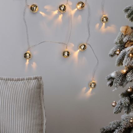 Cadeia de luzes de Natal LED 10xLED/2xAA/branco quente 1,8m com guizos