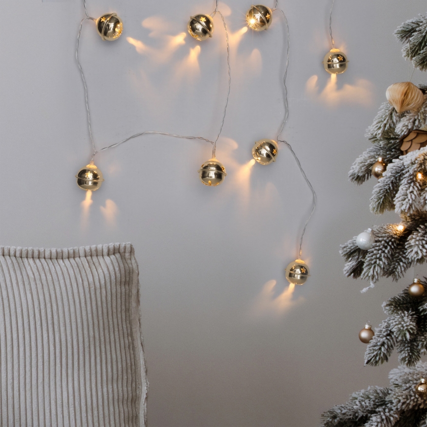 Cadeia de luzes de Natal LED 10xLED/2xAA/branco quente 1,8m com guizos